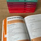 Open Neurology book with differential diagnosis