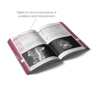 Open Radiology book with structured tables and visuals