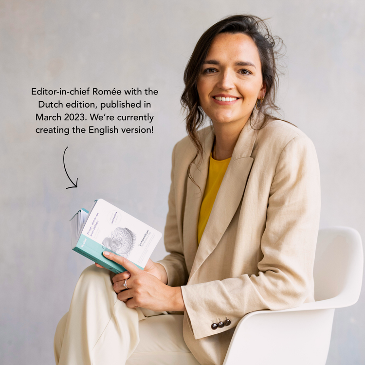 Editor-in-chief holding the Dutch edition of the pocket