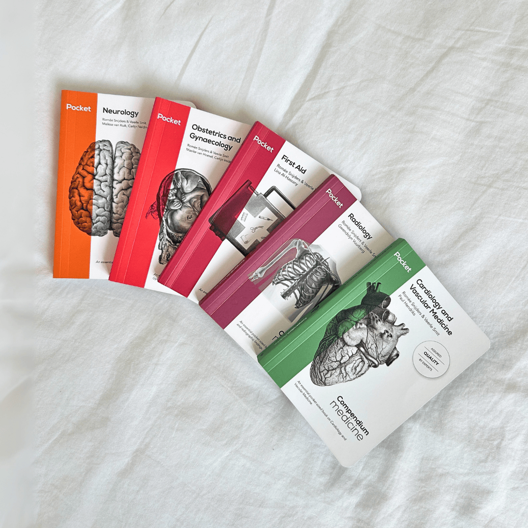 Set of Compendium medical reference books on a white fabric background