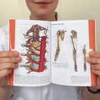 Medical student holding the Neurology pocket guide
